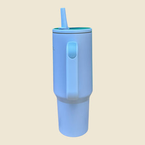 Kashpel 1.2L insulated stainless steel tumbler in light blue with a handle, straw, and matte finish.