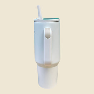 Kashpel 1.2L white insulated stainless steel tumbler with handle, lid, and straw for hot or cold drinks.